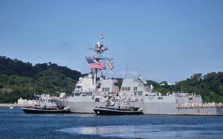 The guided-missile destroyer USS Ralph Johnson arrives at its new homeport, Yokosuka Naval Base, Japan, Monday, Oct. 4, 2021.