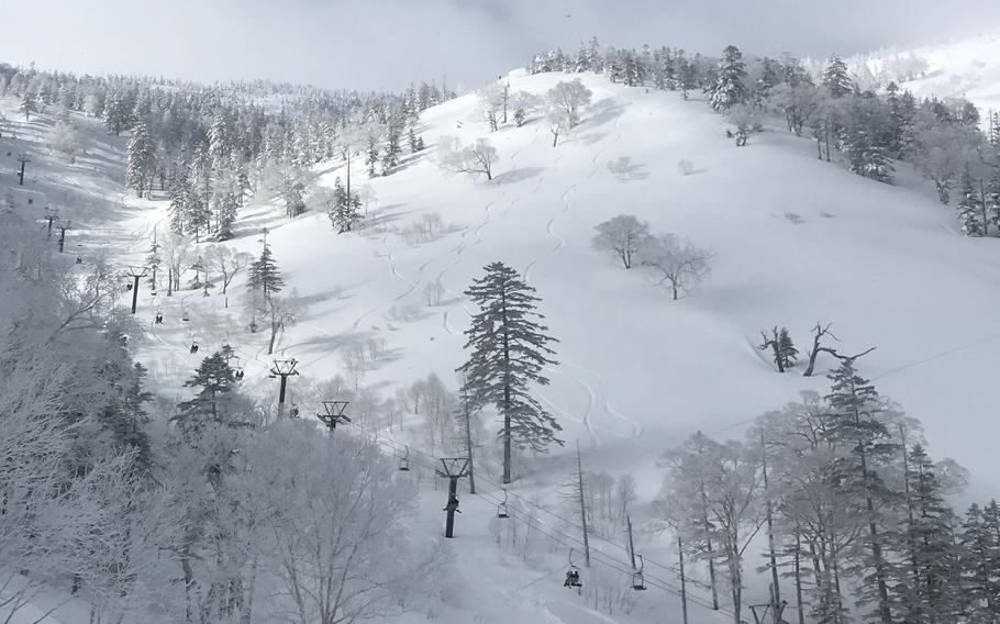 Skiers and snowboarders line up for first tracks at the Kagura ski area in Niigata prefecture, Japan, Jan. 18, 2024. 