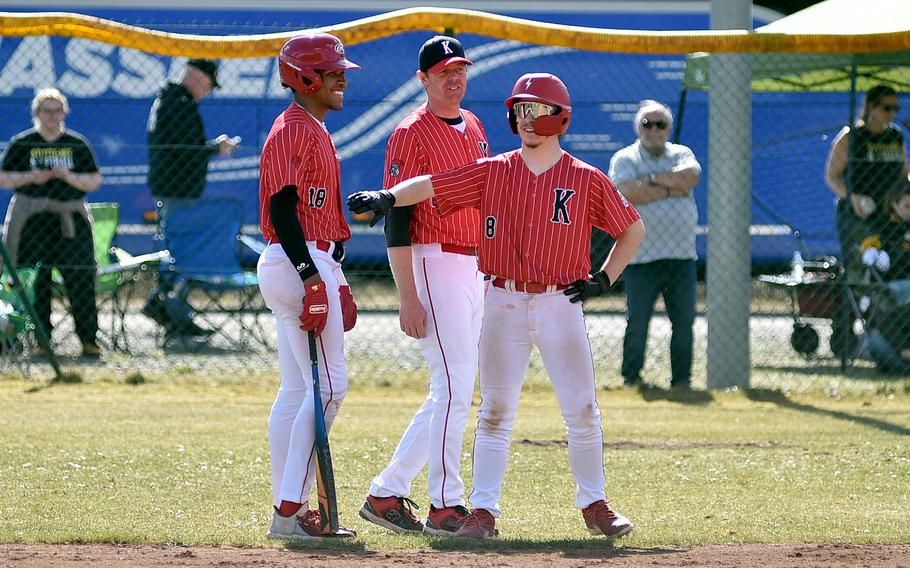 The Raiders huddle at third.