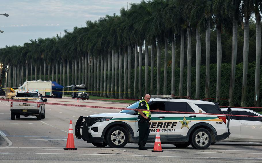 Palm Beach County Sheriff personnel block a road near Trump International Golf Club.