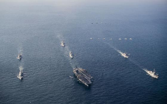 The aircraft carrier USS George Washington leads U.S., Japanese and South Korean destroyers in formation during Freedom Edge 24-2 in the East China Sea, Nov. 13, 2024.