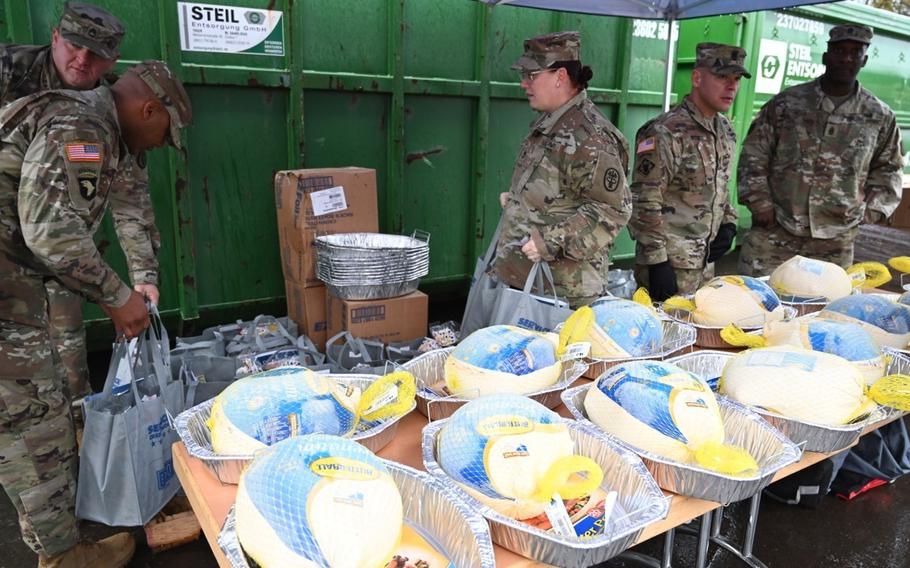 Noncommissioned officers in Kaiserslautern, Germany, prepare Thanksgiving meals in November 2022 intended for junior enlisted service members.