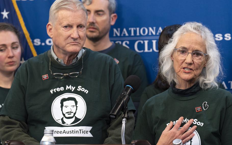 Marc Tice and Debra Tice wear shirts that say Free My Son, Free Austin Tice.