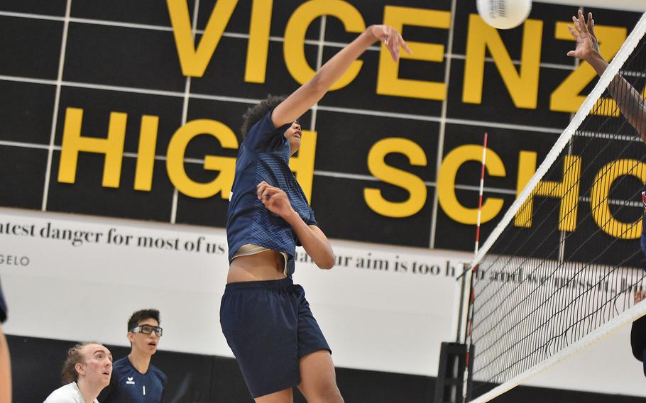 Micah Yakabu sends the ball toward the net.