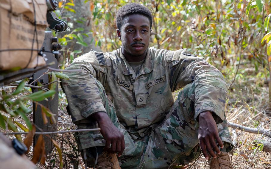 Johnson sits with his teammates during an exercise at Helemano Military Reservation, Hawaii, in November 2023. 