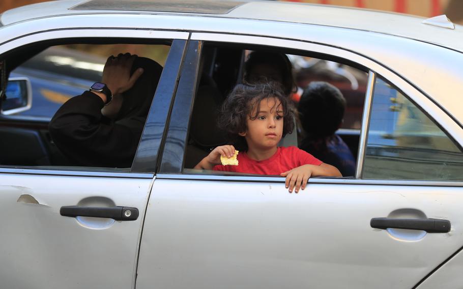 Cars sit in traffic as people flee the southern villages