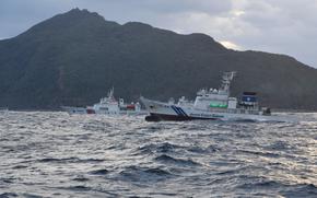 Japan coast guard vessels warn Chinese ships to leave waters near the Senkaku Islands in 2022.