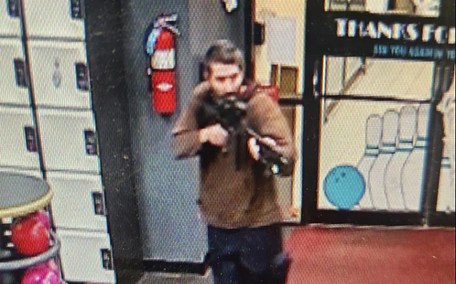 Army reservist Robert Card points a gun while entering Sparetime Recreation in Lewiston, Maine, on Oct. 25, 2023, in this image taken from video.