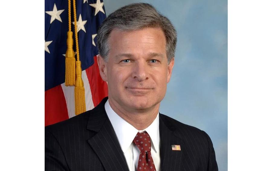 Wray in his official FBI portrait, with an American flag behind him.