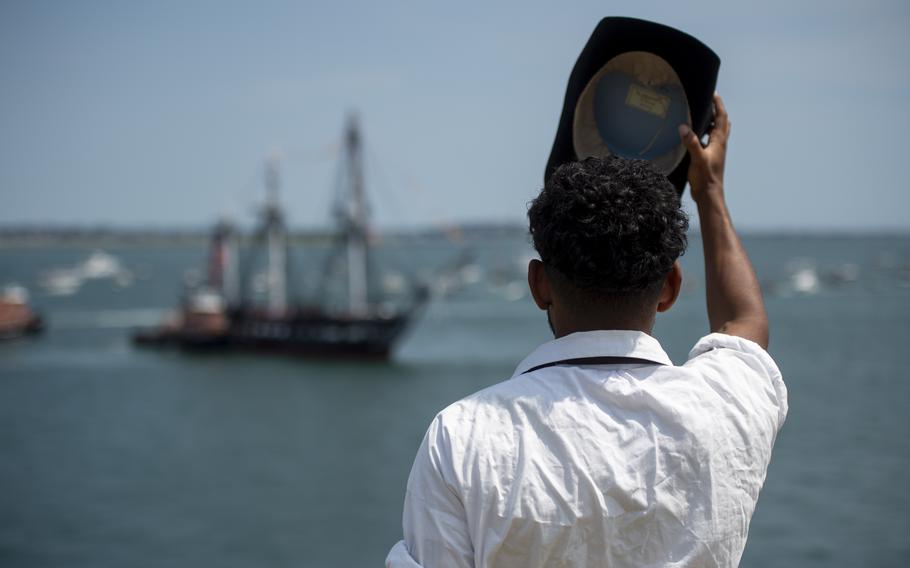 Aviation Electronics Technician 2nd Class Julien Hedden, assigned to USS Constitution, renders a salute as USS Constitution sails through Boston Harbor during a turnaround cruise on Thursday, July 4, 2024. 