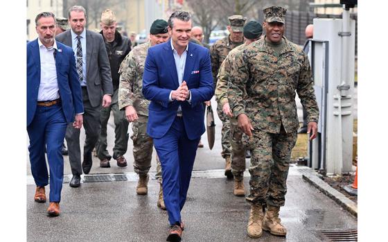 Defense Secretary Pete Hegseth walks with Gen. Michael Langley, commander of U.S. Africa Command, following a town hall meeting at AFRICOM headquarters in Stuttgart, Germany, Feb. 11, 2025.