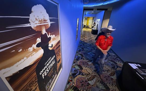 Downwinder Paul Pino heads through the SALA Event Center toward the screening of "First We Bombed New Mexico" during the Oppenheimer Film Festival in Los Alamos, New Mexico on Saturday, Aug. 17, 2024. The documentary tells the stories of those who lived near the Trinity Test Site when the U.S. government detonated the first atomic bomb and the Native Americans who worked in the uranium industry.