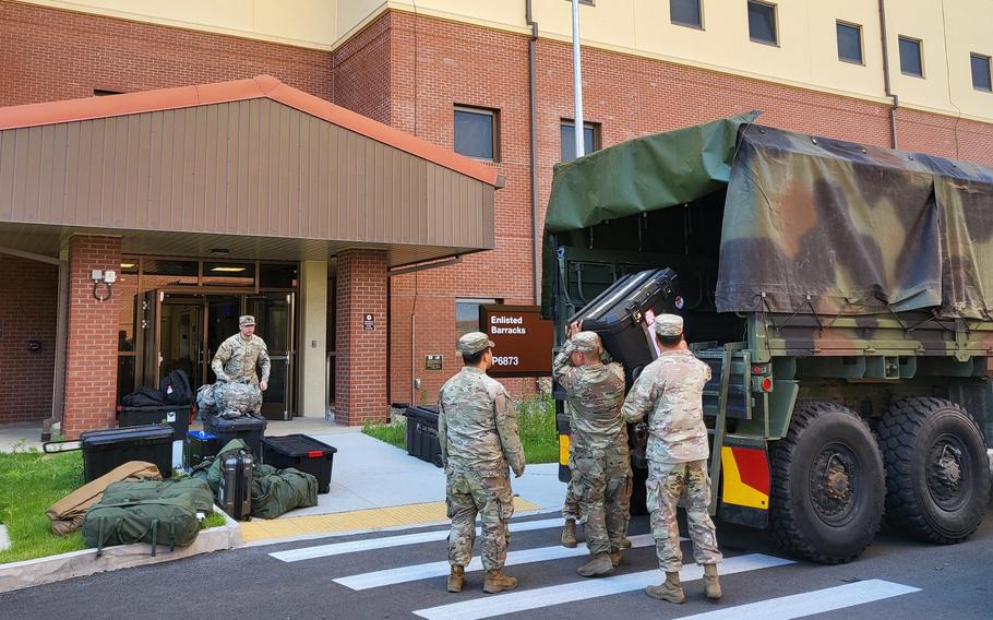 Soldiers move their belongings into a new barracks building on Camp Humphreys, South Korea, May 31, 2024.