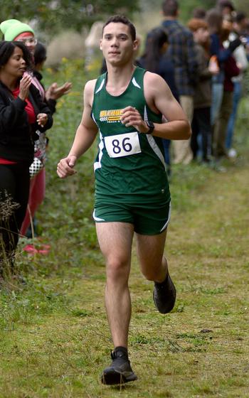 Alconbury's Alan Smith runs through the woods during a cross country meet on Sept. 14, 2024, at Ramstein High School on Ramstein Air Base, Germany.