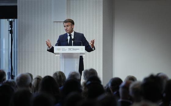 French President Emmanuel Macron speaks, during the IOC Session Opening Ceremony at the Louis Vuitton Foundation ahead of the 2024 Summer Olympics, Monday, July 22, 2024, in Paris, France. (AP Photo/Thibault Camus)