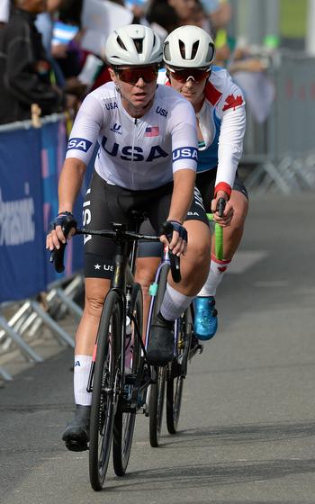 The USA's Shawn Morelli leads Canada's Keely Shaw into a corner during the cycling road race at the 2024 Paris Paralympics in Clichy-sous-Bois, France, Sept. 6, 2024. Morelli, a U.S. Army veteran who was seriously injured in Afghanistan in 2007, finished 14th.