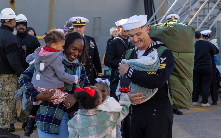 Sailor greets family