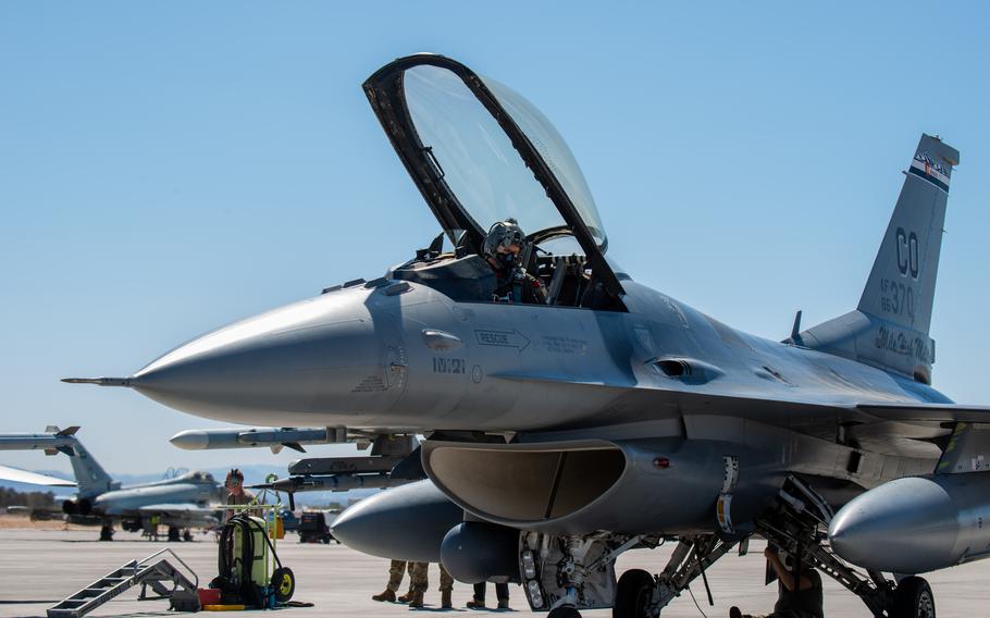 An airmen in the cockpit of an aircraft