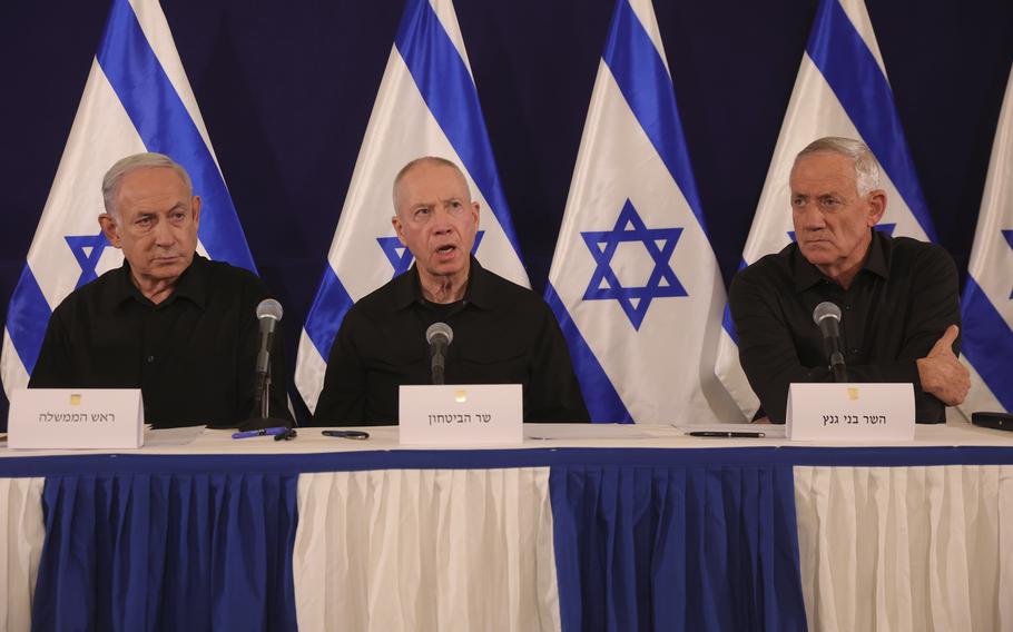 From left, Israeli Prime Minister Benjamin Netanyahu, Defense Minister Yoav Gallant and Cabinet Minister Benny Gantz speak during a news conference in Tel Aviv on Oct. 28, 2023.