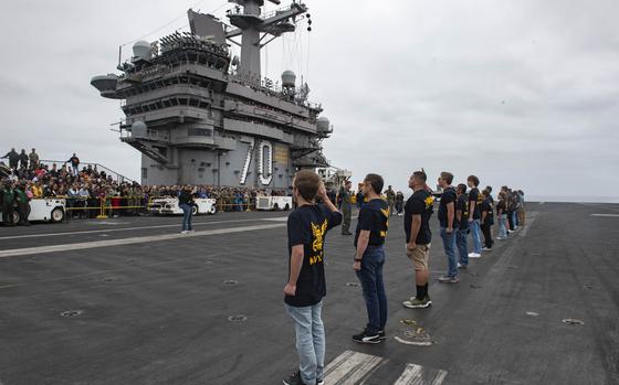 240817-N-DP708-1003 PACIFIC OCEAN (Aug. 17, 2024) Future Sailors enlist into the U.S. Navy on the flight deck aboard Nimitz-class aircraft carrier USS Carl Vinson (CVN 70) while underway for a Family and Friends Day Cruise in the U.S. 3rd Fleet area of operations. As an integral part of U.S. Pacific Fleet, U.S. 3rd Fleet operates naval forces in the Indo-Pacific in addition to providing realistic and relevant training necessary to flawlessly execute our Navy’s timeless roles of sea control and power projection. U.S. 3rd Fleet works in close coordination with other numbered fleets to provide commanders with capable, ready forces to deploy forward and win in day-to-day competition, in crisis, and in conflict. (U.S. Navy photo by Mass Communication Specialist 2nd Class Analice Baker)