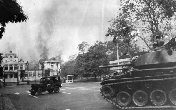 Saigon, South Vietnam, Feb. 27, 1962: A tank can be seen moving toward the Presidential Palace in Saigon, a Jeep already standing in front of the palace gates, as smoke and flames billow out of the west wing of the palace after it was hit during the Feb. 27, 1962 surprise strafing-bombing attack. The attack -- carried out by two dissenting Republic of Vietnam Air Force pilots -- killed three and wounded 30.

Stars and Stripes photographer Al Chang - in Saigon on another assignment that day - happened to be near the presidential palace early morning and rushed to the scene to document it. 

Although his original negatives are not in Stars and Stripes' archives, we do have three of the six original photo prints of the images that ran in the paper. The prints were created by Stars and Stripes Pacific's photo department at the time to run in the print newspaper and are often the only images we have of much of Pacific Stars and Stripes' news photography from the years prior to 1964 as the vast majority of pre-1964 Stars and Stripes Pacific negatives and slides were unwittingly destroyed by poor temporary storage in 1963.

Check out the images of the other two prints found, as well as the original published photo spread here. 

Looking for more Stars and Stripes’ coverage of the early days of the US involvement in Vietnam? Subscribe to Stars and Stripes’ historic newspaper archive! We have digitized our 1948-1999 European and Pacific editions, as well as several of our WWII editions and made them available online through https://starsandstripes.newspaperarchive.com/

META TAGS: Pacific; South Vietnam; Vietnam War; attack; bombing; Independence Palace bombing