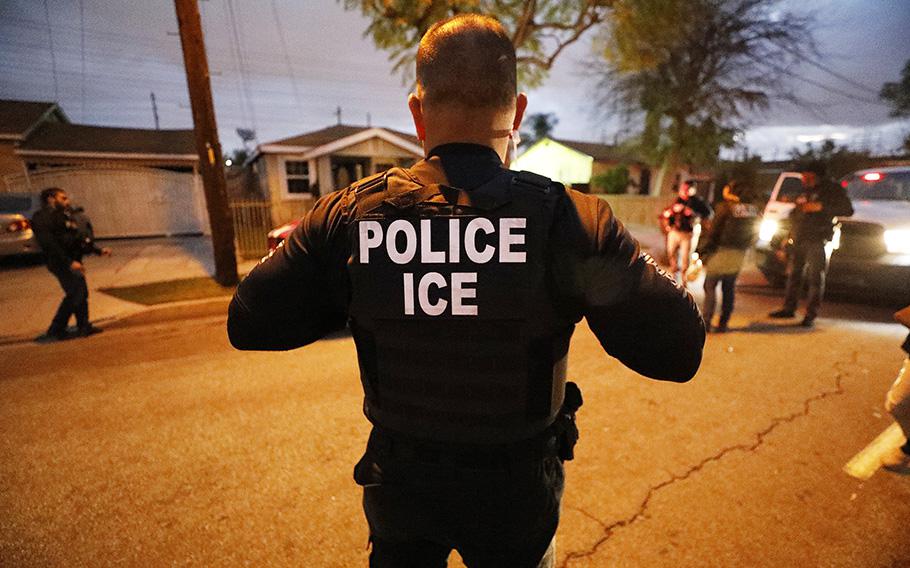 U.S. Immigration and Customs Enforcement on the scene during a pre-dawn apprehension in Bell Gardens, California, on March 16, 2020. ICE deported an Afghani man and then returned him back to the U.S. in an unusual move for the agency. 