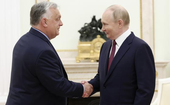Russian President Vladimir Putin, right, and Hungarian Prime Minister Viktor Orban shake hands during a meeting in Moscow, Russia, Friday, July 5, 2024. 
