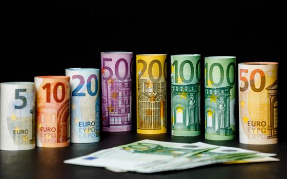 Euro banknotes on black background. 