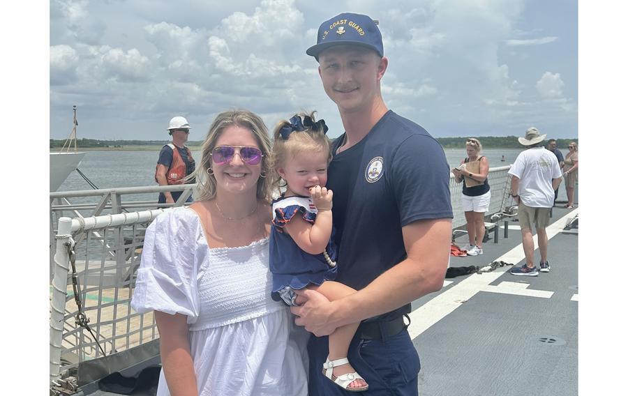 Coast Guard Petty Officer 2nd Class Quinton Paes, a machinery technician assigned to Coast Guard Cutter Stone (WMSL 758), poses for a photo aboard the cutter with his family, July 24, 2024, while moored in North Charleston, S.C. Stone returned home after a 63-day patrol in the Atlantic Ocean and Caribbean Sea. 