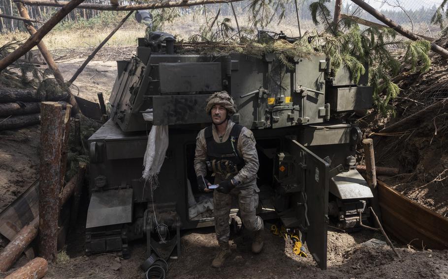 A Ukrainian soldier prepares a shell to use in a U.S.-made M109 howitzer last month.