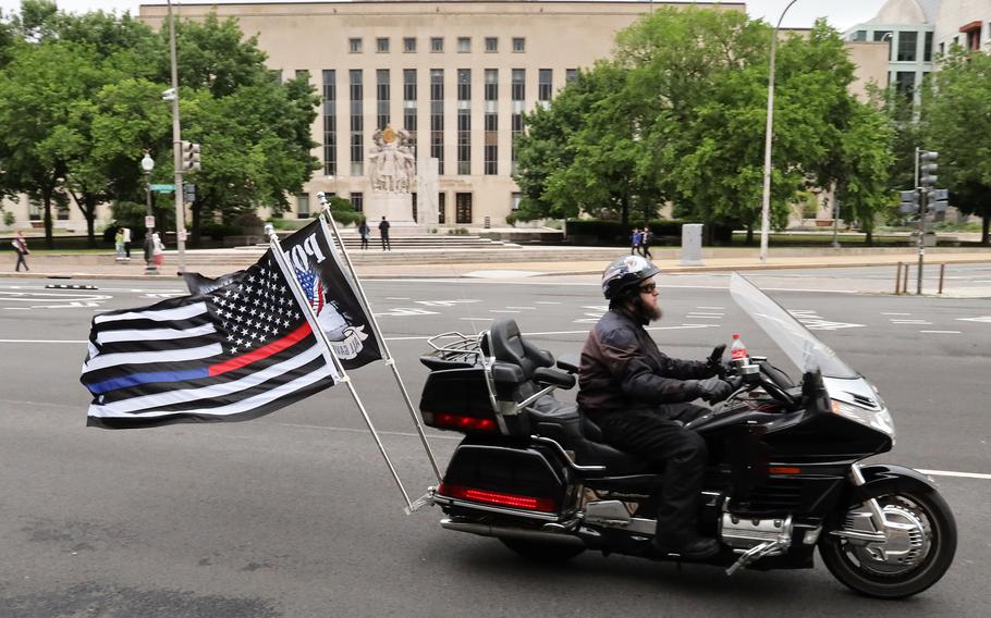 Motorcyclists taking part in the Rolling to Remember ride move down Constitution Ave. in Washington, D.C., May 30, 2021.