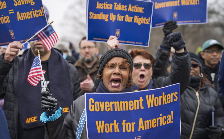 Sona Anderson of San Diego, center, shouts her support for civil service workers