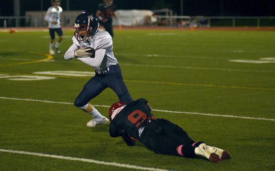 Lakenheath receiver Jeremiah Kreider breaks out of a tackle by Kaiserslautern's Josh Kim during an Oct. 4, 2024, game at Babers Stadium in Kaiserslautern, Germany.