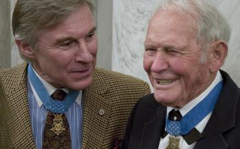 Medal of Honor recipients Paul Bucha, left, and John Finn at a reception in Washington, D.C. in 2007. Bucha died July 31, 2024 at age 80.