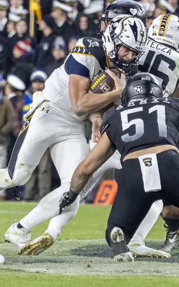 Navy’s Blake Horvath (11) rushes for yardage during the second half of the Army-Navy game, Dec. 14, 2024, in Landover, Md.