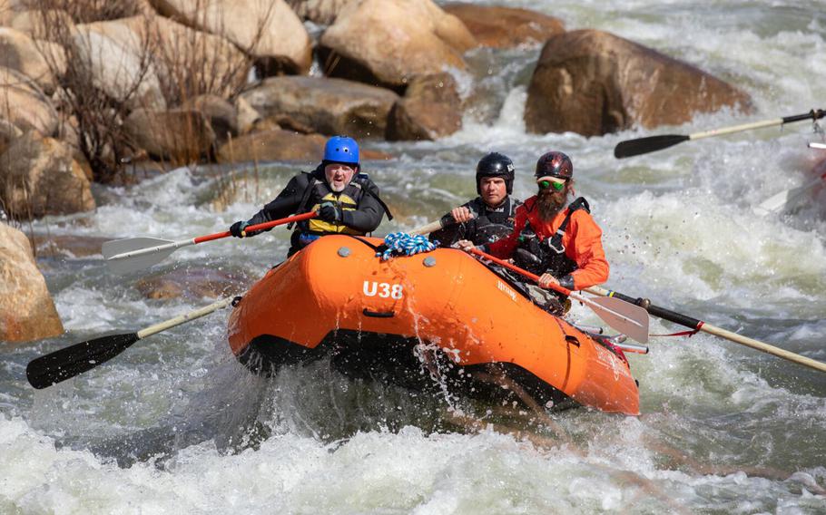 Los Angeles Times reporter Jack Dolan, left, negotiates The Wall during a whitewater tour with Evan Moore, general manager of Sierra South Mountain Sports, and guide Zach Wilfey, on the upper Kern River on April 6, in Kernville, Calif. The winter and early spring storms have brought plenty of water which is good news for the local businesses. 