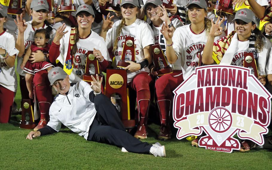 Oklahoma coach Patty Gasso, front left, and players pose for a photo after defeating Florida State last J in Oklahoma City. Oklahoma begins its quest for an unprecedented fourth consecutive national softball title. (AP Photo/Nate Billings, File)