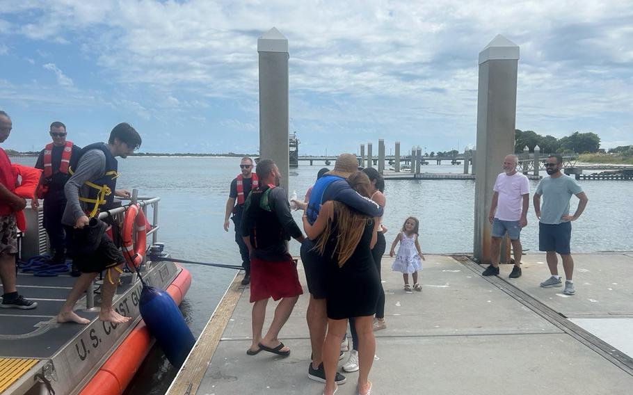 A Coast Guard Station Mayport, Fla., boat crew rescues five people after their vessel capsized offshore on Sunday, July 7, 2024. The crew transported the men to Mayport Boat Ramp to awaiting family members.