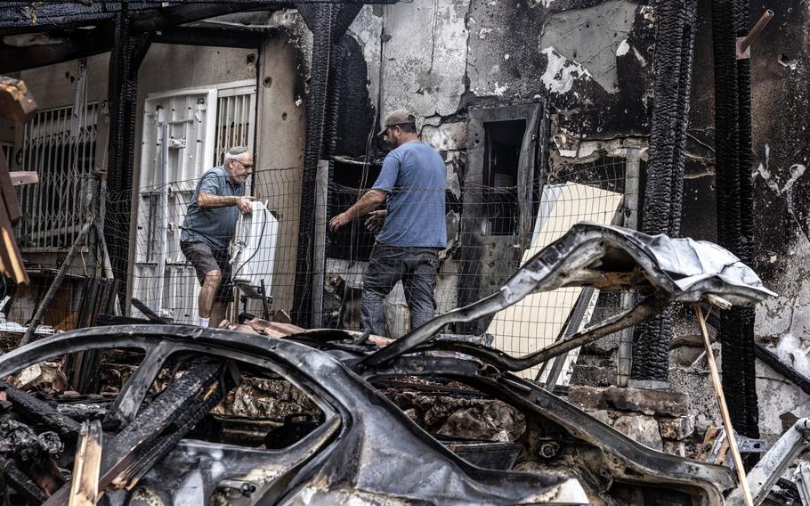 Moti Fitch outside his damaged home in Moreshet