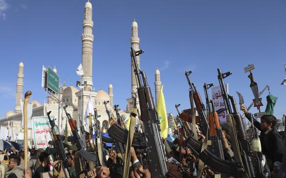 Houthi supporters raise their machine guns during an Anti- U.S and Israel rally in Sanaa, Yemen, Friday, Nov. 1, 2024. (AP Photo/Osamah Abdulrahman)