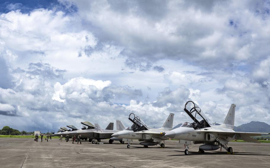 F-22 Raptors from the 27th Expeditionary Fighter Squadron park next to Philippine FA-50PH light jet fighters at Basa Air Base, Philippines, Aug. 8, 2024. 