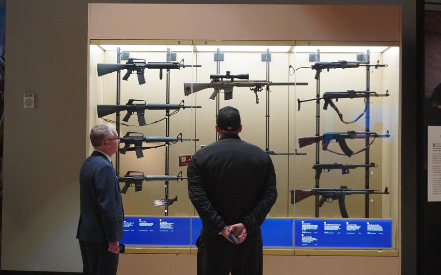 SEAL Team actor David Boreanaz looks at a case exhibiting weapons