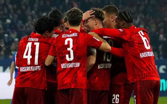 FC Kaiserslautern players huddle during a game.  