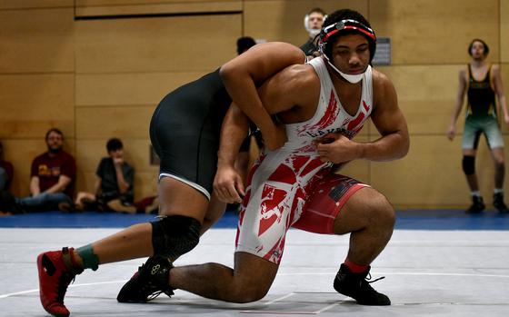 Lakenheath's Adrian Hill spins out of the control of AFNORTH's David Diaz during a 215-pound wrestling match on Jan. 25, 2025, at Spangdahlem High School in Spangdahlem, Germany.