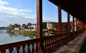 The Ponte Vecchio in Bassano del Grappa, Italy, offers views of the Italian Alps and the Brenta River.