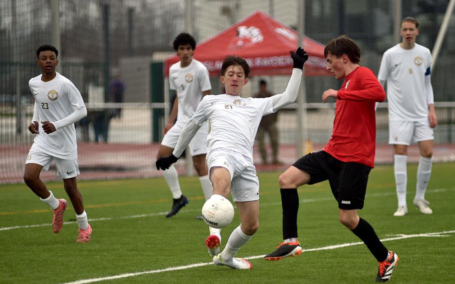 Kenneth Spicer gets to the ball first.