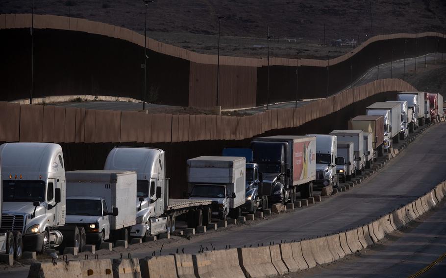 Trucks lined up at a border crossing.