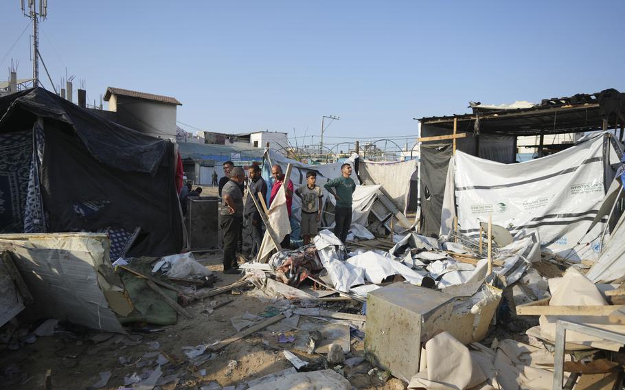 Gazans survey the damage of an Israeli strike in the courtyard of the Al-Aqsa Hospital and refugee camp, Nov. 9, 2024.