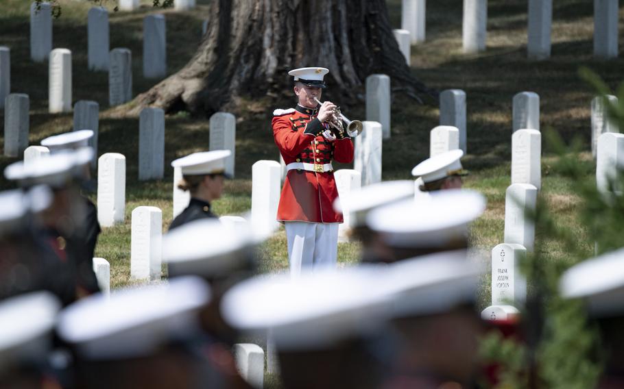 A trumpeter from the Marine Band “The President’s Own” plays Taps during military funeral honors with funeral escort for retired Gen. Alfred Gray Jr., the 29th Commandant of the Marine Corps, in Section 35 of Arlington National Cemetery, Arlington, Va., July 29, 2024. 