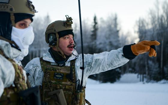 U.S. Air Force Tech. Sgt. Richard Padilla, a security forces craftsman assigned to the 24th Special Operations Wing, Detachment 1, also known as Deployment Cell or “D-Cell”, directs Airmen during a training exercise at Joint Base Elmendorf-Richardson, Alaska, Jan. 7, 2023. Based out of MacDill Air Force Base, Florida, D-Cell consists of 54 members across 15 job codes forming four agile teams, whose primary role is to “bare base” – to rapidly turn undeveloped locations into fully functional bases. The unit visited Alaska to train and test their capabilities in an arctic environment. (U.S. Air Force photo by Senior Airman Patrick Sullivan)